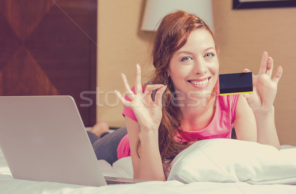 woman shopping on line holding showing credit card giving ok sign.  Stock photo © ichiosea