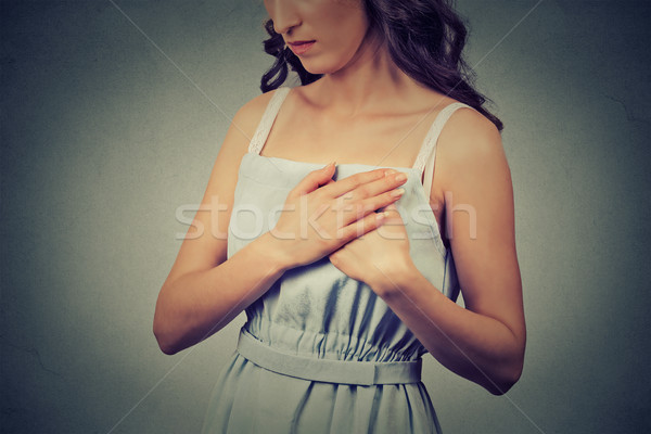woman with heart attack sudden pain, health problem holding touching her chest  Stock photo © ichiosea
