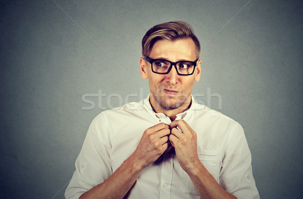 Nervous stressed man feels awkward anxiously craving something  Stock photo © ichiosea