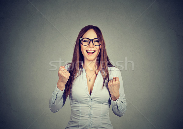 woman with fists pumped celebrating success Stock photo © ichiosea