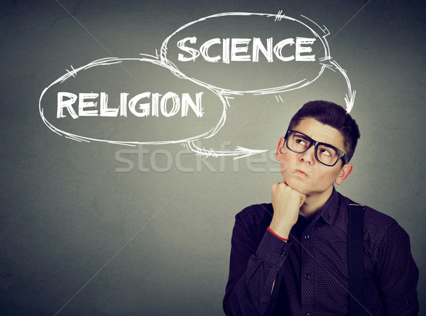 Thoughtful man making up his mind science or religion   Stock photo © ichiosea