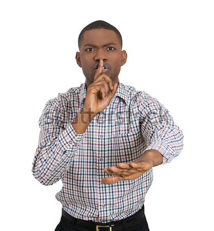 young man placing finger on lips as if to say ssshhh Stock photo © ichiosea