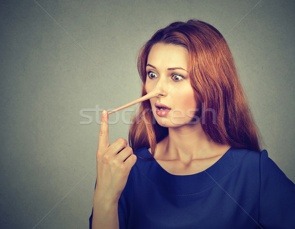 Woman with long nose. Liar concept. Stock photo © ichiosea