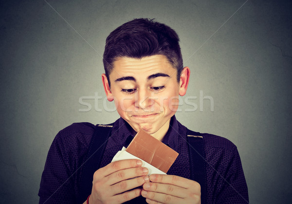 Man tired of diet restrictions craving sweets chocolate.  Stock photo © ichiosea