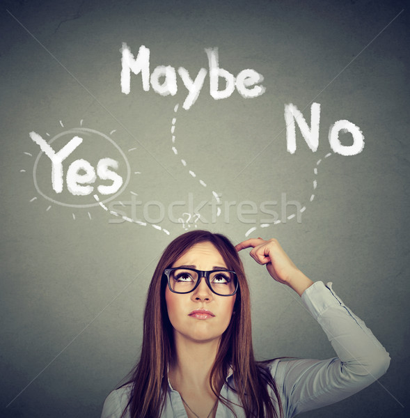 Yes Maybe or No? Thoughtful woman making a choice  Stock photo © ichiosea