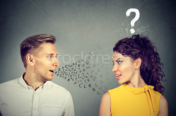 Man talking to an attractive woman with question mark  Stock photo © ichiosea