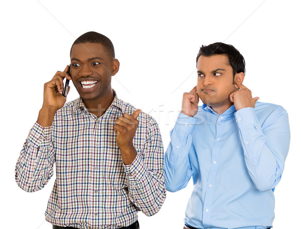 one man annoyed with another who talks loudly over the phone Stock photo © ichiosea