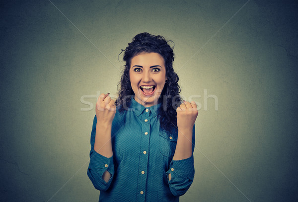 happy young woman happy exults pumping fists ecstatic celebrates success  Stock photo © ichiosea