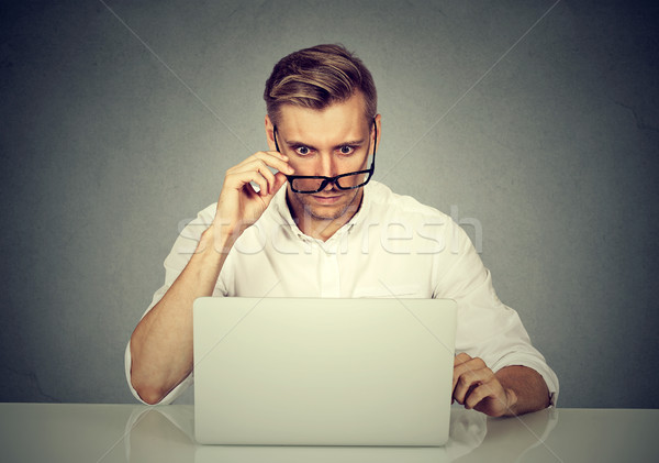 Karışık adam bakıyor dizüstü bilgisayar iş Stok fotoğraf © ichiosea