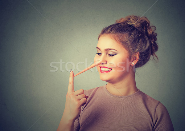Liar concept. Happy woman with long nose. Human face expression emotion Stock photo © ichiosea