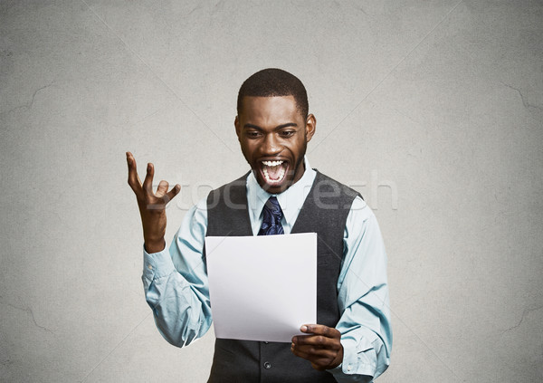 Stock photo: Excited happy man holding document, receiving goood news