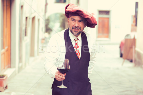 Stock photo: Portrait of a mature happy man with glass of red wine outdoors in old italian village 