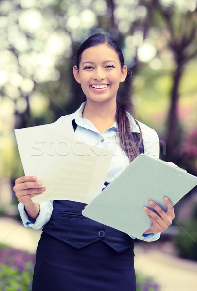 happy young businesswoman standing reading, company documents Stock photo © ichiosea