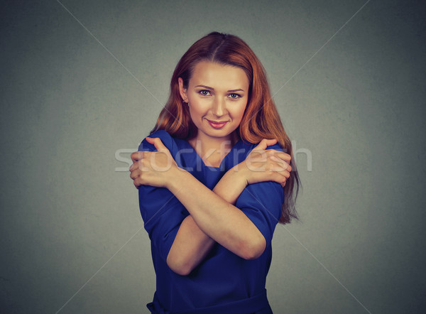 confident smiling woman holding hugging herself  Stock photo © ichiosea