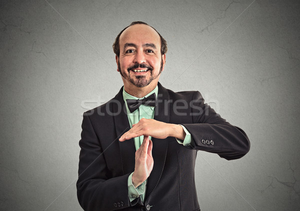 Businessman showing time out sign hand gesture Stock photo © ichiosea
