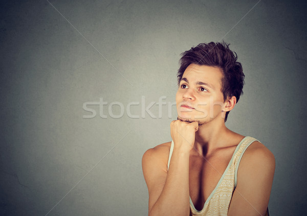 Preoccupied thinking young man looking up Stock photo © ichiosea