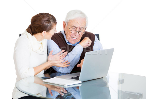 Stock photo: Niece teaching grandfather use laptop