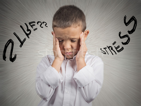 Stressed child, having headache  Stock photo © ichiosea
