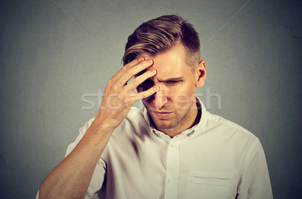stressed sad young man looking down Stock photo © ichiosea