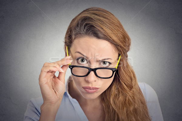 Headshot angry bitchy woman with glasses skeptically looking at you Stock photo © ichiosea