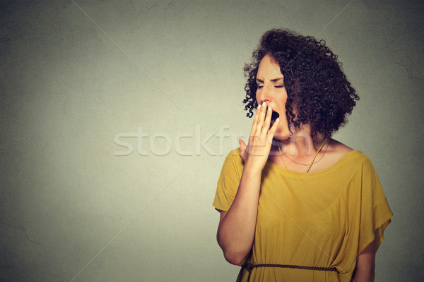 Sonolento mulher jovem grande abrir boca Foto stock © ichiosea