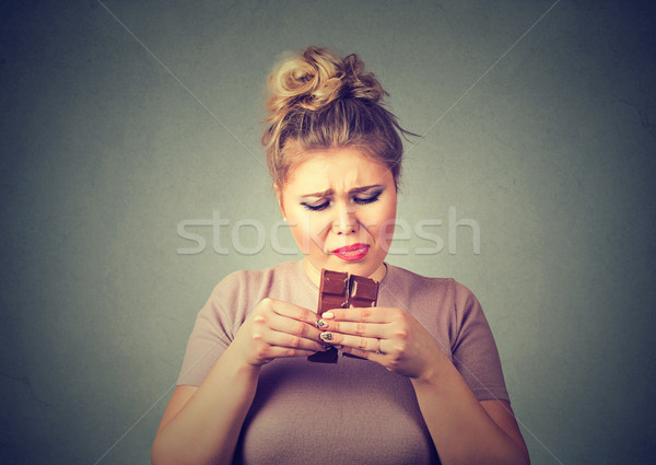 young woman tired of diet restrictions craving sweets chocolate  Stock photo © ichiosea