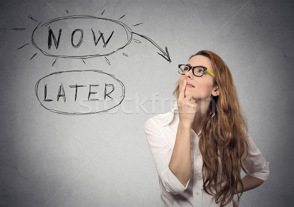 Stock photo: Now or later. Woman thinking looking up. Human face expression 
