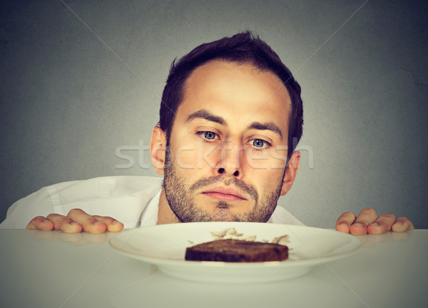 éhes férfi sóvárgás édes étel arc asztal Stock fotó © ichiosea