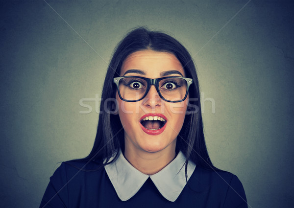 Surprised young woman shouting. Looking at camera Stock photo © ichiosea