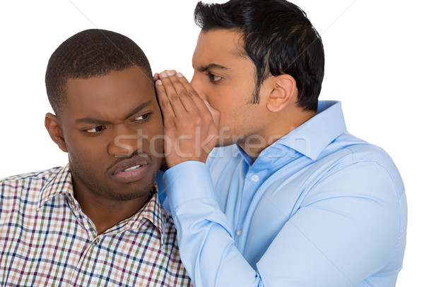 guy whispering something annoying into man's ears Stock photo © ichiosea