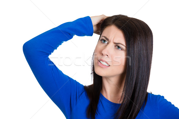 Stock photo: Worried woman scratching head