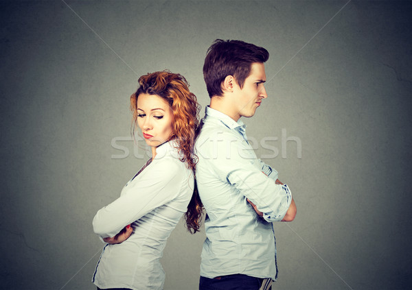 Stock photo: Angry frustrated young couple standing back to back