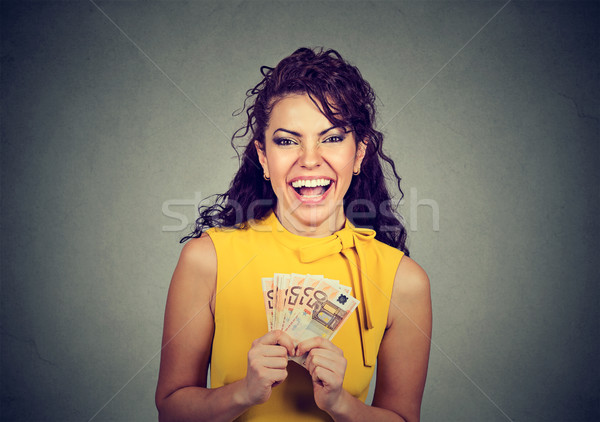 happy young woman holding money  Stock photo © ichiosea