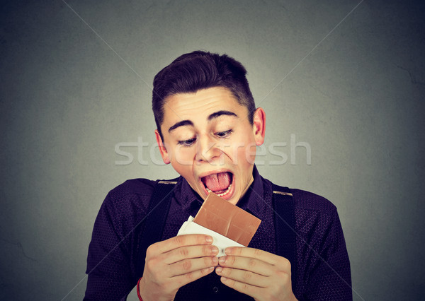 man eating a chocolate  Stock photo © ichiosea