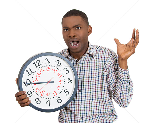 Business man holding a clock, pressured by lack of time running out Stock photo © ichiosea