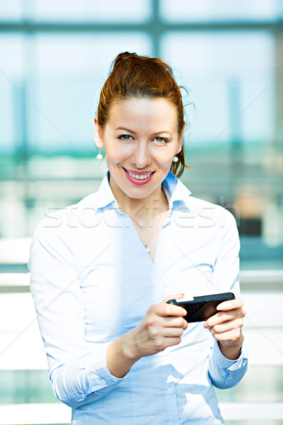 Stock photo: Business woman sending text message on phone