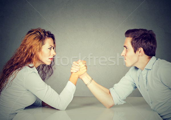 Business people woman and man arm wrestling   Stock photo © ichiosea