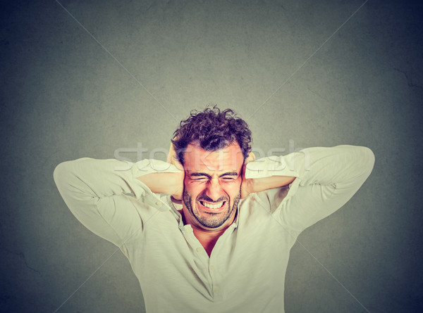 Hangsúlyos fiatalember zaklatott csalódott izolált szürke Stock fotó © ichiosea
