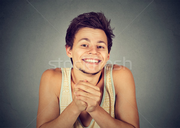 Jonge man tonen handen mooie geïsoleerd grijs Stockfoto © ichiosea