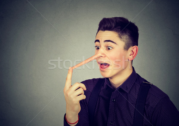 Man with long nose. Liar concept.  Stock photo © ichiosea