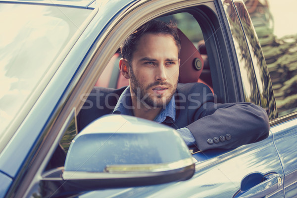 Handsome serious man driving a car Stock photo © ichiosea