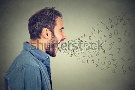 Man talking with alphabet letters coming out of his mouth Stock photo © ichiosea