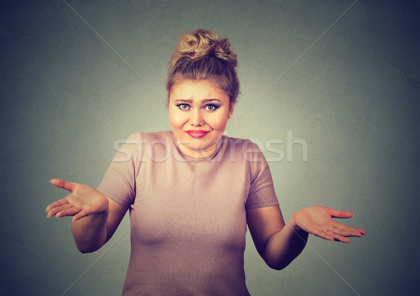 dumb looking woman arms out shrugs shoulders who cares so what I don't know Stock photo © ichiosea