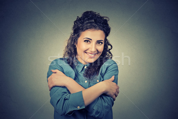 confident smiling woman holding hugging herself. Love yourself concept Stock photo © ichiosea