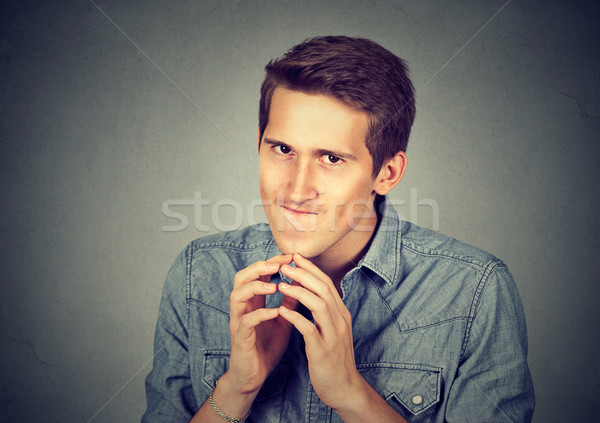 Junger Mann etwas isoliert grau Wand negative Stock foto © ichiosea
