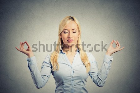 Stock photo: hopeful woman crossing her fingers hoping