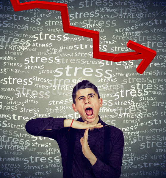 Man showing time out gesture screaming bring down stress level  Stock photo © ichiosea