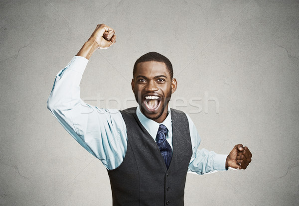Excited happy man celebrates success, good outcome Stock photo © ichiosea