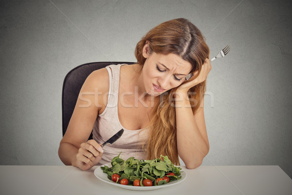 Triste comer ensalada aislado Foto stock © ichiosea
