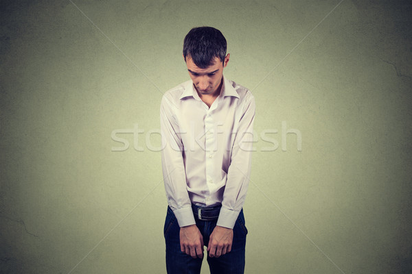 Smutne samotny młody człowiek patrząc w dół nie energii Zdjęcia stock © ichiosea
